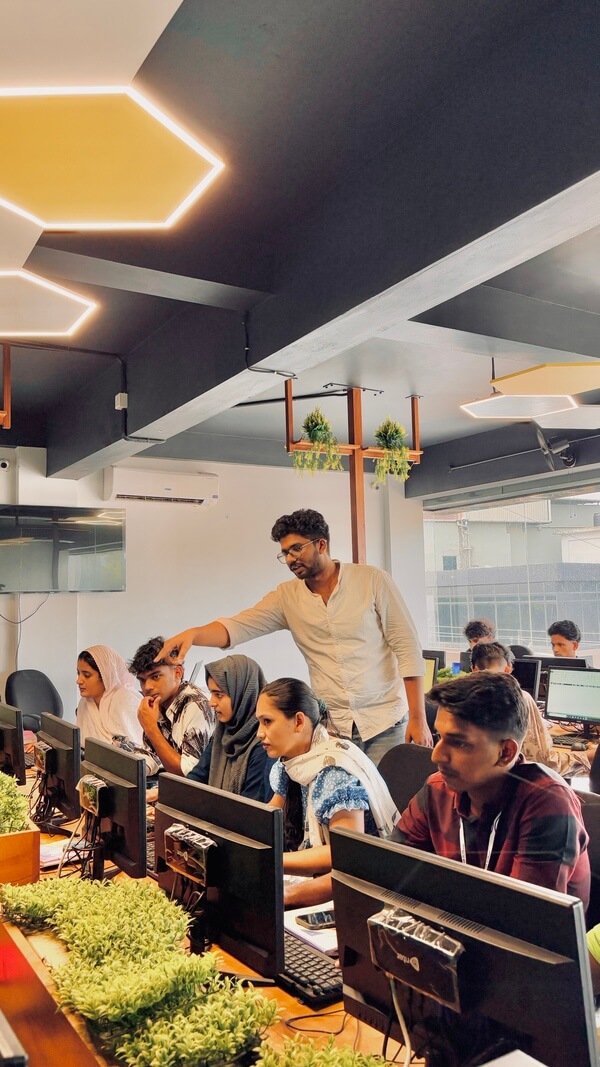 A mentor guiding students through practical work